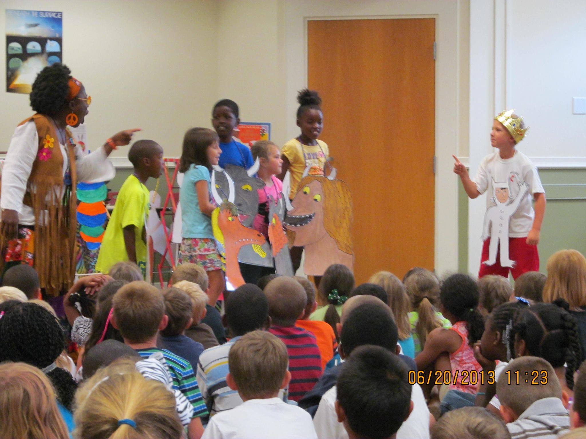Storyteller in colourful African clothing performing