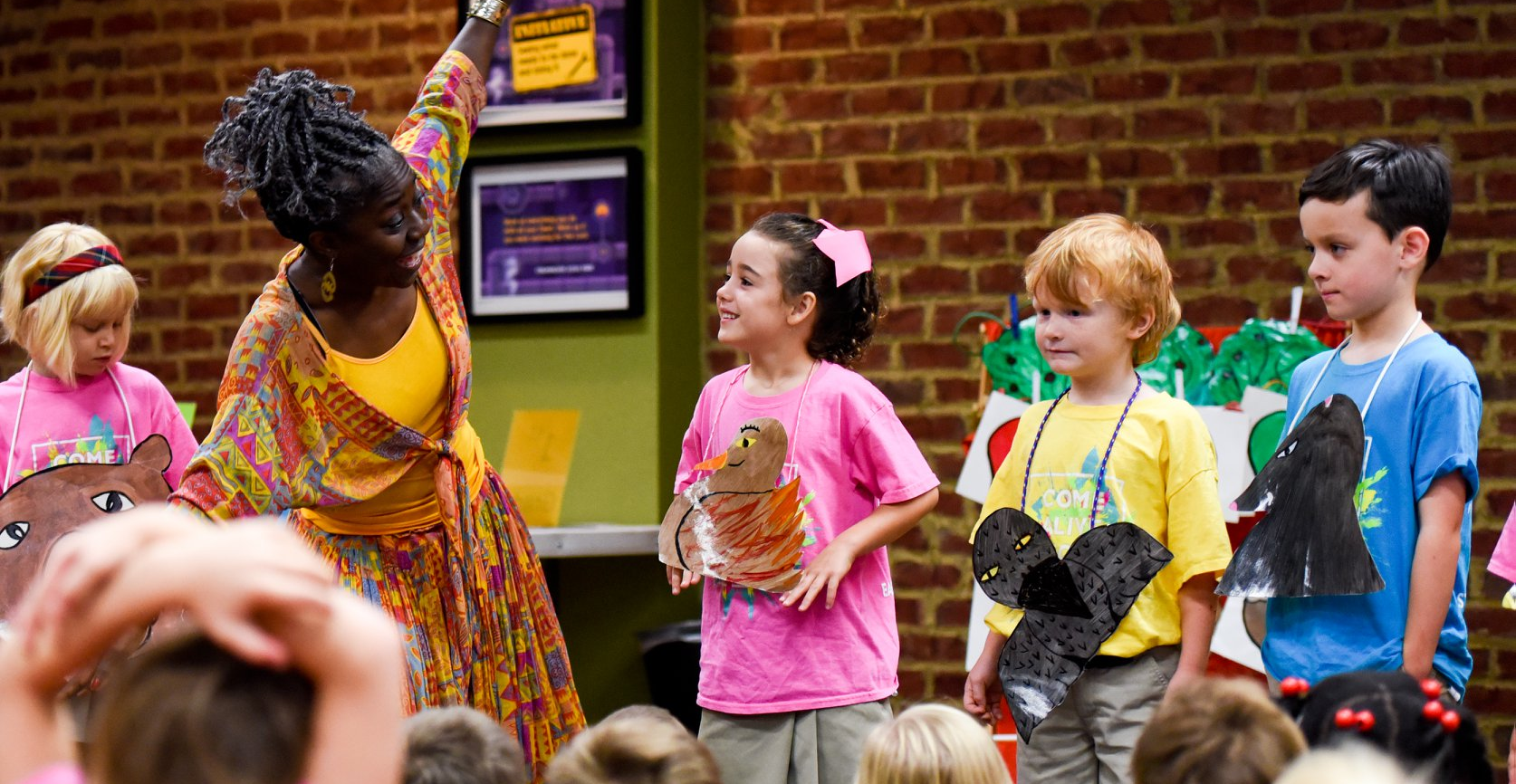 Children with storyteller close up joyful