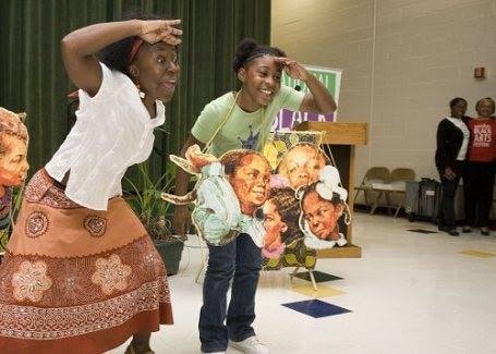 Children and storyteller at cultural celebration
